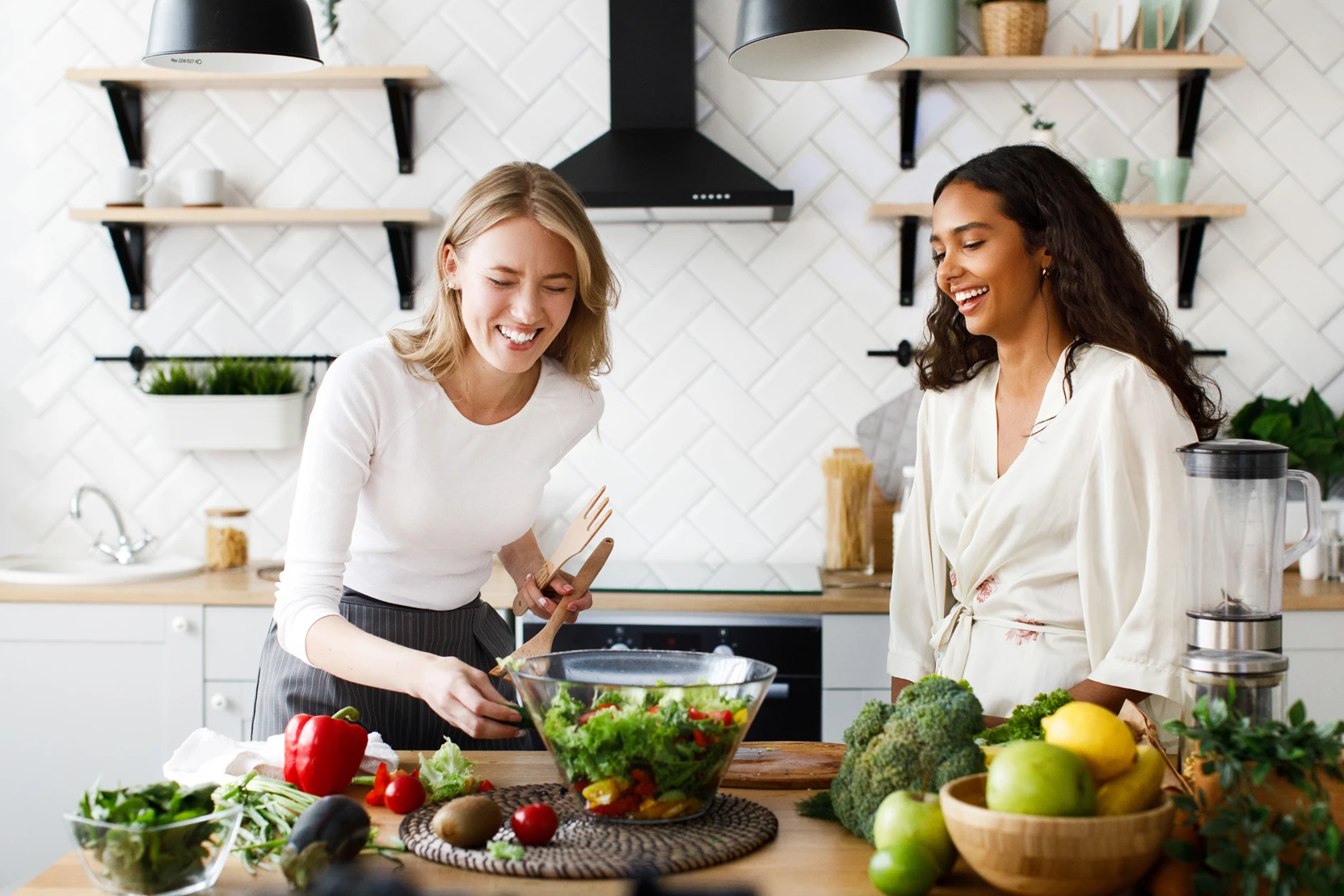 women-different-nationalities-are-happy-cooking-salad-kitchen